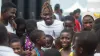 Arms Around The Child ambassador Christian Atsu with children in Ghana 