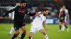 Stoke's Josh Laurent (left) challenges Swansea’s Joe Allen 