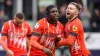 Luton’s Pelly-Ruddock Mpanzu (centre) celebrates