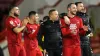 Orient players and staff celebrate following the final whistle 