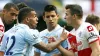 QPR’s Joey Barton argues with Manchester City’s Carlo Tevez 