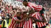 Josh Dasilva is mobbed by his Brentford team-mates (Nick Potts/PA)