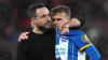 Brighton and Hove Albion manager Roberto De Zerbi comforts Solly March after missing a penalty