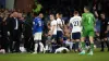 Harry Kane lays on the floor after a clash with Abdoulaye Doucoure