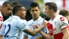 QPR’s Joey Barton argues with Manchester City’s Carlos Tevez