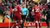 Liverpool’s Andy Robertson (left) confronts linesman Constantine Hatzidakis during the game (Nick Potts/PA)