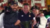 Wrexham co-owners Ryan Reynolds (left), Rob McElhenney (right) and manager Phil Parkinson (centre) celebrate promotion 