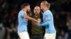 Manchester City manager Pep Guardiola with striker Erling Haaland and defender Ruben Dias