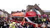 Luton players celebrated their promotion to the Premier League on Monday (Steven Paston/PA)