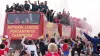 Fans gather to watch Wrexham’s open-top bus parade to celebrate their promotion from the National League (Martin Rickett/PA)