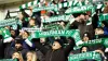 Hibernian fans hold up scarves in memory of chairman Ron Gordon