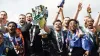 Plymouth manager Steven Schumacher, left of trophy, and his players celebrate winning the League One title (Nick Potts/PA)