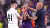 Cristiano Biraghi (centre) receives treatment after objects thrown by fans hit him in the head (Tim Goode/PA)