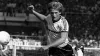 Gordon McQueen in action for Manchester United (PA)