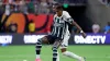 Manchester United forward Marcus Rashford, left, blocks out as he passes the ball in front of Real Madrid defender David Ala