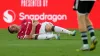 Wrexham forward Paul Mullin stays on the field after an injury during the first half of a club friendly soccer match against