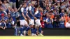 Luke Woolfenden (centre) celebrates opening the scoring for Ipswich (George Tewkesbury/PA).