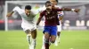 Rangers’ Connor Goldson, left, and Servette’s Dereck Kutesa battle for the ball (Laurent Gillieron/Keystone via AP)