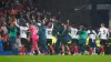 Luton players celebrate their first Premier League win with their fans (Peter Byrne/PA)