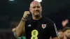 Wales manager Rob Page celebrates his side’s 2-0 win over Latvia in Riga (Tim Goode/PA)