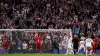 Tottenham celebrate their last-gasp winner (John Walton/PA)