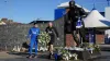 Everton captain Seamus Coleman and manager Sean Dyche lay flowers by the Dixie Dean statue outside Goodison Park in tribute 