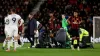 Luton defender Tom Lockyer received treatment on the pitch before the game was eventually called off (Steven Paston/PA)