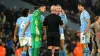 Manchester City players surround referee Simon Hooper during the 94th-minute of their 3-3 draw with Tottenham (Martin Ricket