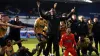 George Elokobi celebrates with the Maidstone players after a memorable 2-1 win at Ipswich (Joe Giddens/PA)