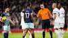 Referee David Coote speaks to Brentford and Tottenham players during a heated London derby (Zac Goodwin/PA)