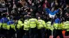 Police officers attempt to contain trouble between rival fans during West Brom’s FA Cup fourth round tie against Wolves (Bra