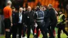 A Port Vale fan is restrained after running onto the pitch (Jess Hornby/PA)