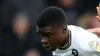 Salford City’s Kelly N’Mai and Scunthorpe United’s Jai Rowe (right) battle for the ball during the Sky Bet League Two match 