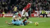 Taiwo Awoniyi tangles with diving Newcastle goalkeeper Martin Dubravka (Richard Sellers/PA)