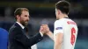 England manager Gareth Southgate shakes hands with Harry Maguire. (Nick Potts/PA)