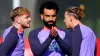 Liverpool’s Harvey Elliott, left, Mohamed Salah, centre, and Kostas Tsimikas, right, in training (Peter Byrne/PA)