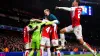 Arsenal players celebrate after winning the penalty shoot-out of the UEFA Champions League Round of 16 (Zac Goodwin, PA)