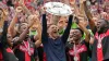 Xabi Alonso celebrates with the trophy after Bayer Leverkusen claimed the Bundesliga title (Martin Meissner/AP)