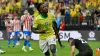 Brazil’s Vinicius Junior celebrates scoring his side’s opening goal against Paraguay (David Becker/AP)