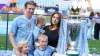 Kevin De Bruyne poses for a photo with wife Michele Lacroix and their three children (Martin Rickett/PA)