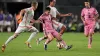 Inter Miami forward Lionel Messi, centre front, works to retain control of the ball under pressure from St Louis City defend