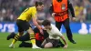Borussia Dortmund’s Marcel Sabitzer helps stadium stewards tackle a pitch invader (Nick Potts/PA)