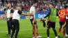 Spain captain Alvaro Morata, centre, reacts after being involved in a collision with stadium security following their Euro 2