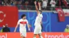 Merih Demiral, right, gestures to the crowd after scoring Turkey’s second goal against Austria (Adam Davy/PA)