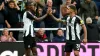 Alexander Isak, left, celebrates his winner with Newcastle captain Bruno Guimaraes (Owen Humphreys/PA)