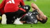 Harry Kane receives treatment to his left ankle (Sven Hoppe/dpa via AP)