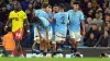 Matheus Nunes, centre, is congratulated by team-mates after scoring Manchester City’s second goal (Martin Rickett/PA)