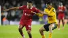 Liverpool’s Trent Alexander-Arnold (left) and Wolverhampton Wanderers’ Andre battle for the ball (PA)