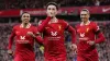 Curtis Jones (centre) celebrates scoring Liverpool’s winner (Peter Byrne/PA)