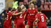 Liverpool players celebrate Marie Hobinger’s late winner from the spot (Nigel French/PA)